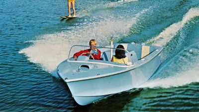 Water skier being pulled by boat on lake