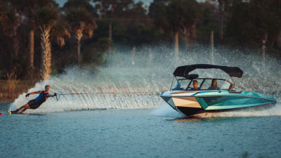 Water Skier making waves behind Nautique Boat