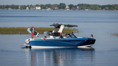 Wakeboarder on Nautique boat on water